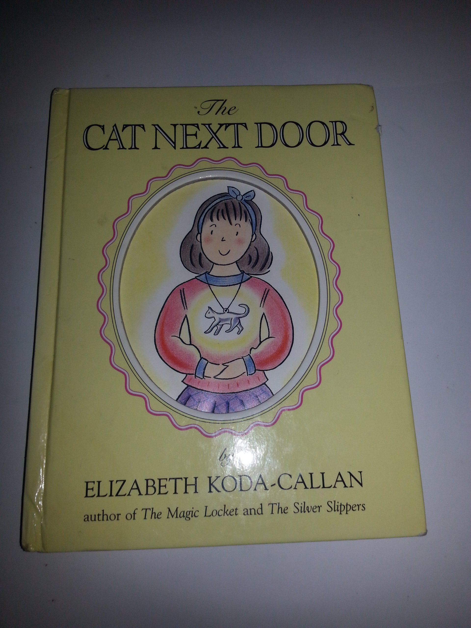 The Cat Next Door (Elizabeth Koda-Callan's Magic Charm Books, 6th) Non-fiction