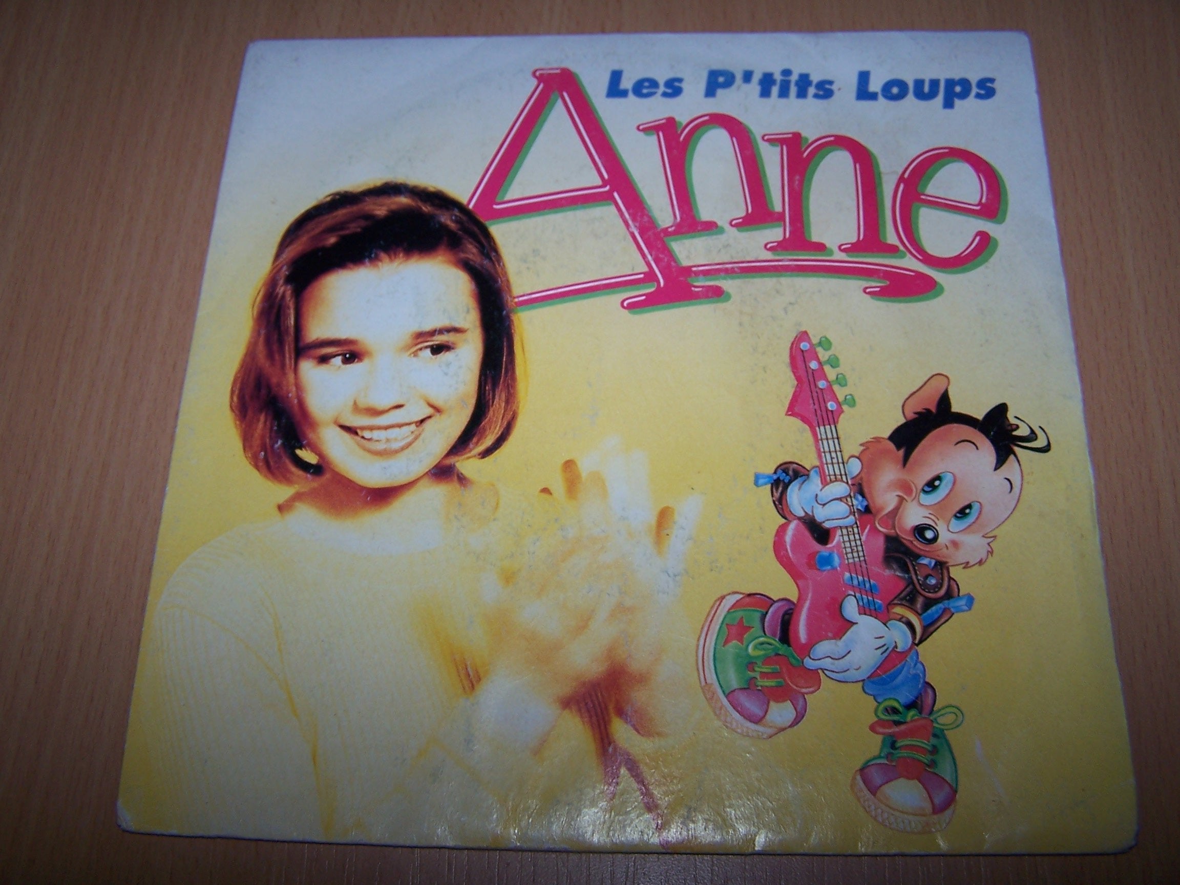 Les P'tits Loups / Un P'tit grain de folie 45t 1990 cd
