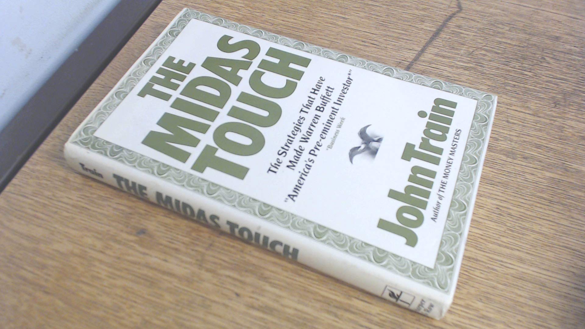 The Midas Touch: The Strategies That Have Made Warren Buffett America's Pre-Eminent Investor Business, Finance & Career