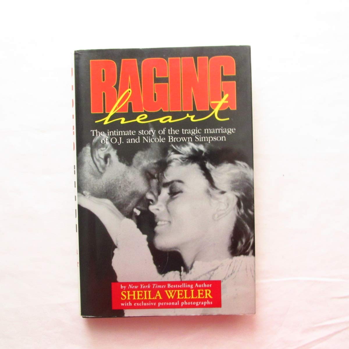Raging Heart: The Intimate Story of the Tragic Marriage of O.J. and Nicole Brown Simpson Law