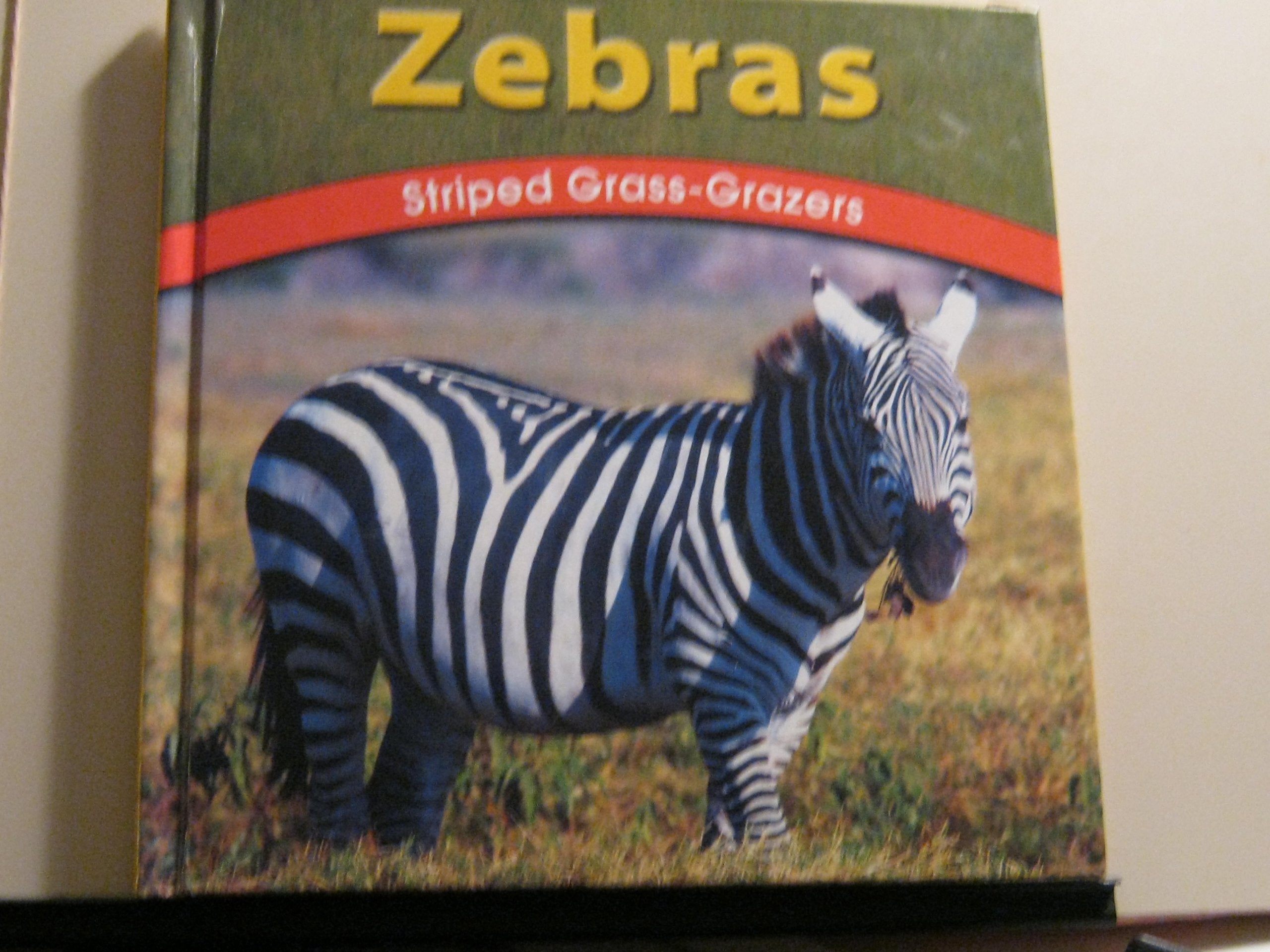 Zebras: Striped Grass-Grazers (Wild World of Animals) Non-fiction