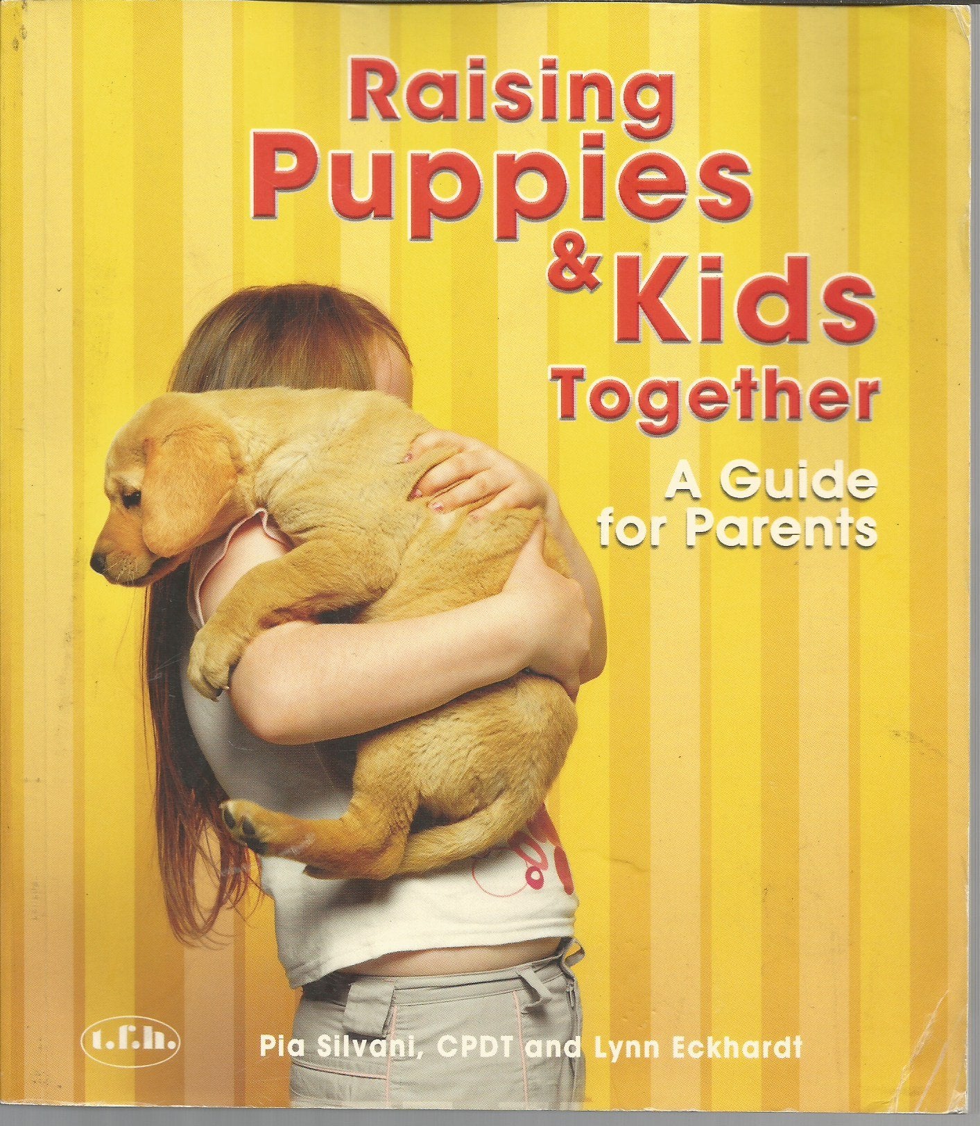 Raising Puppies & Kids Together: A Guide for Parents book