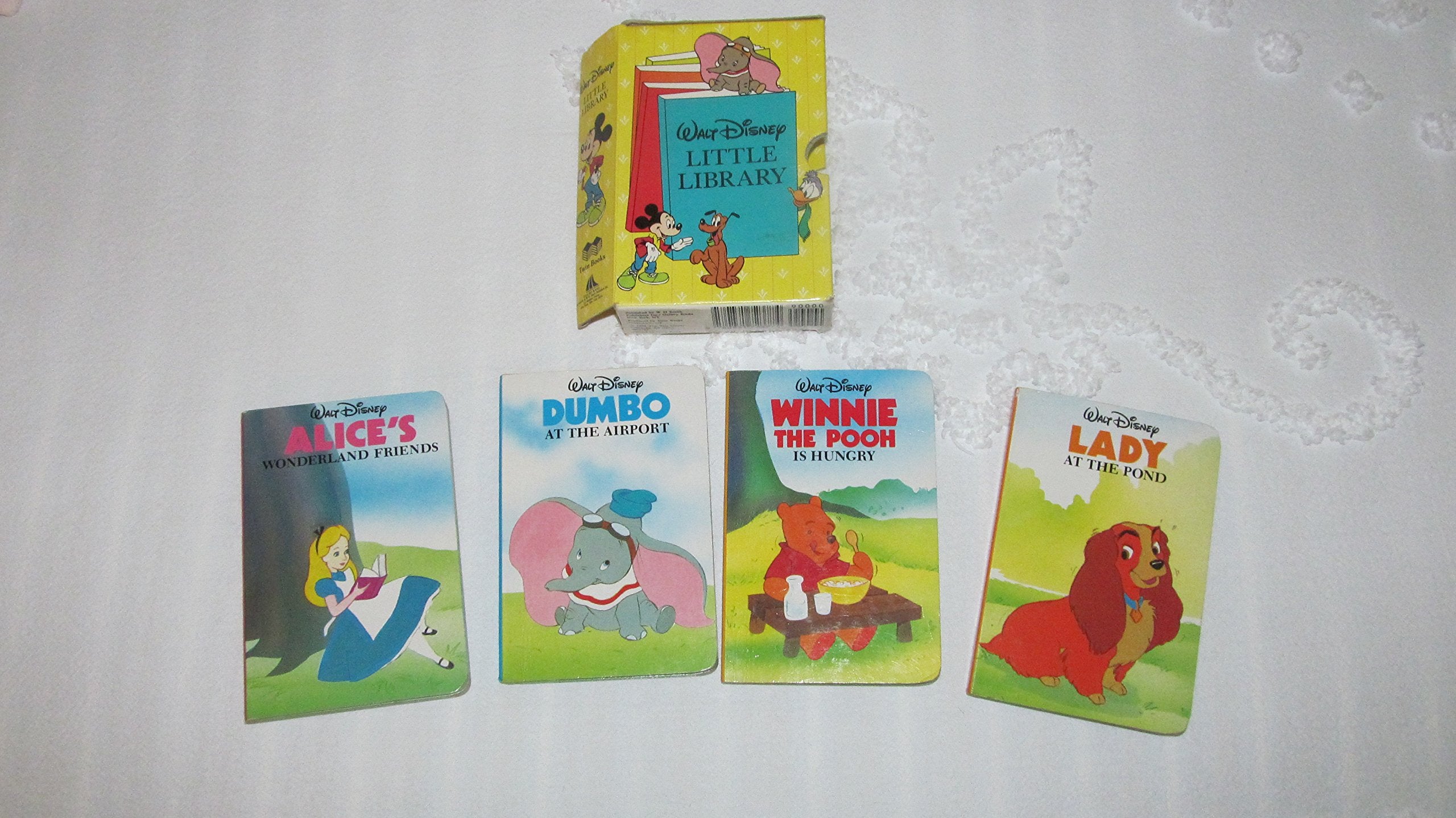 Walt Disney Little Library: Prepack B (Alice in Wonderland, Lady at the Pond, Dumbo at the Airport, Winnie-The-Pooh Is Hungry) Books