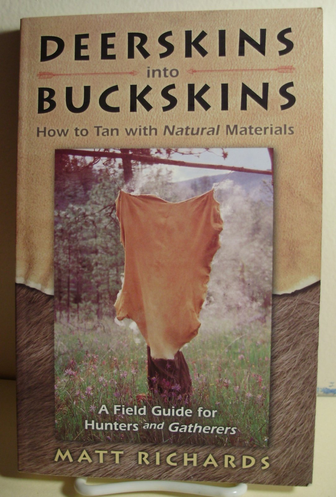 Deerskins into Buckskins: How to Tan Natural Materials - A Field Guide for Hunters and Gatherers Business & Technology