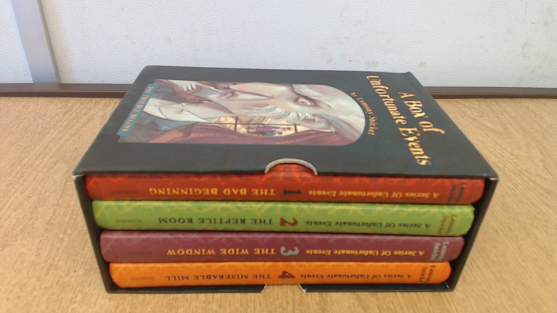 A Series of Unfortunate Events: "The Bad Beginning", "The Reptile Room", "The Wide Window", "The Miserable Mill" book