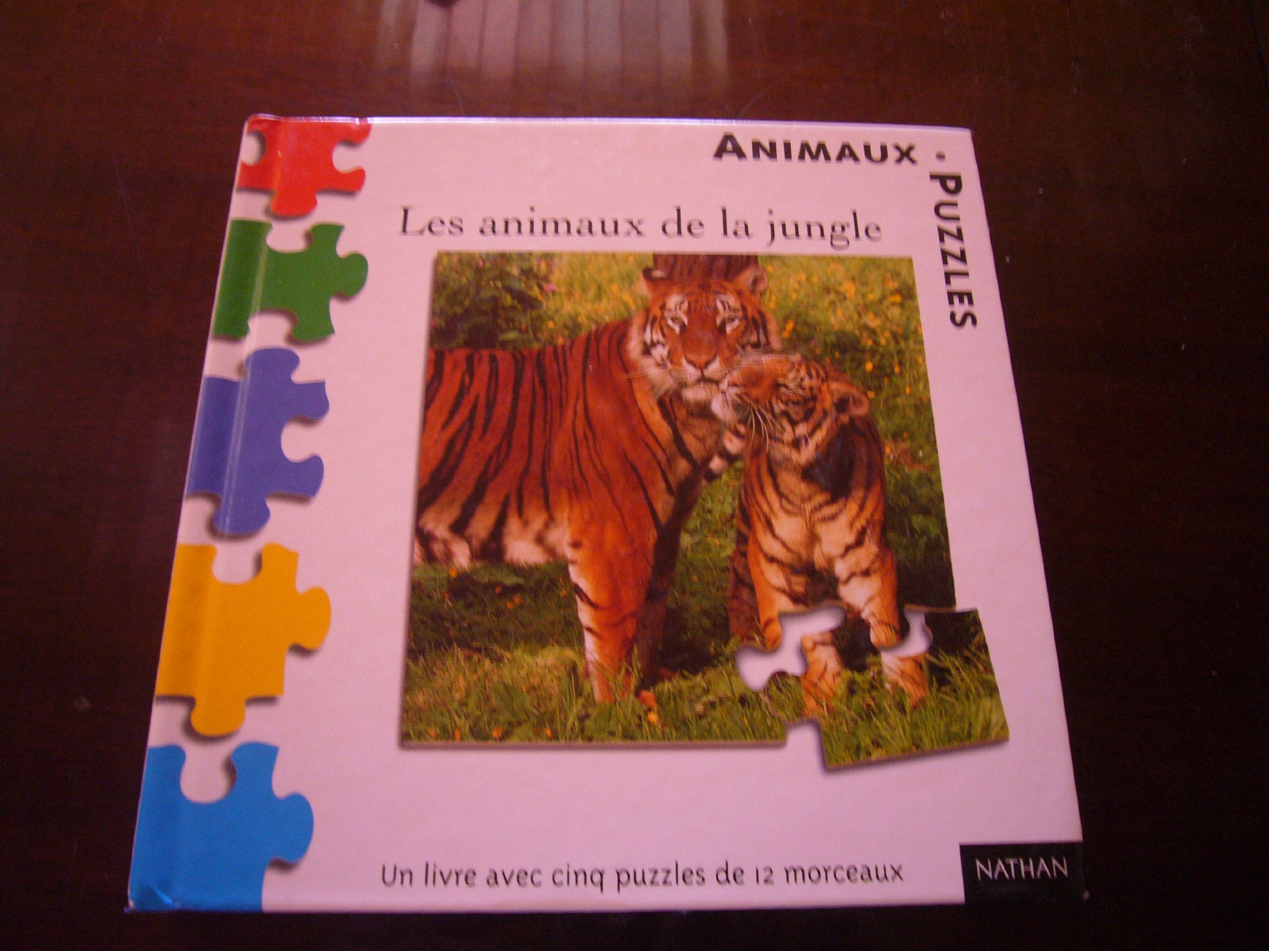 Les Animaux de la jungle (1 livre + 5 puzzles de 12 morceaux) book