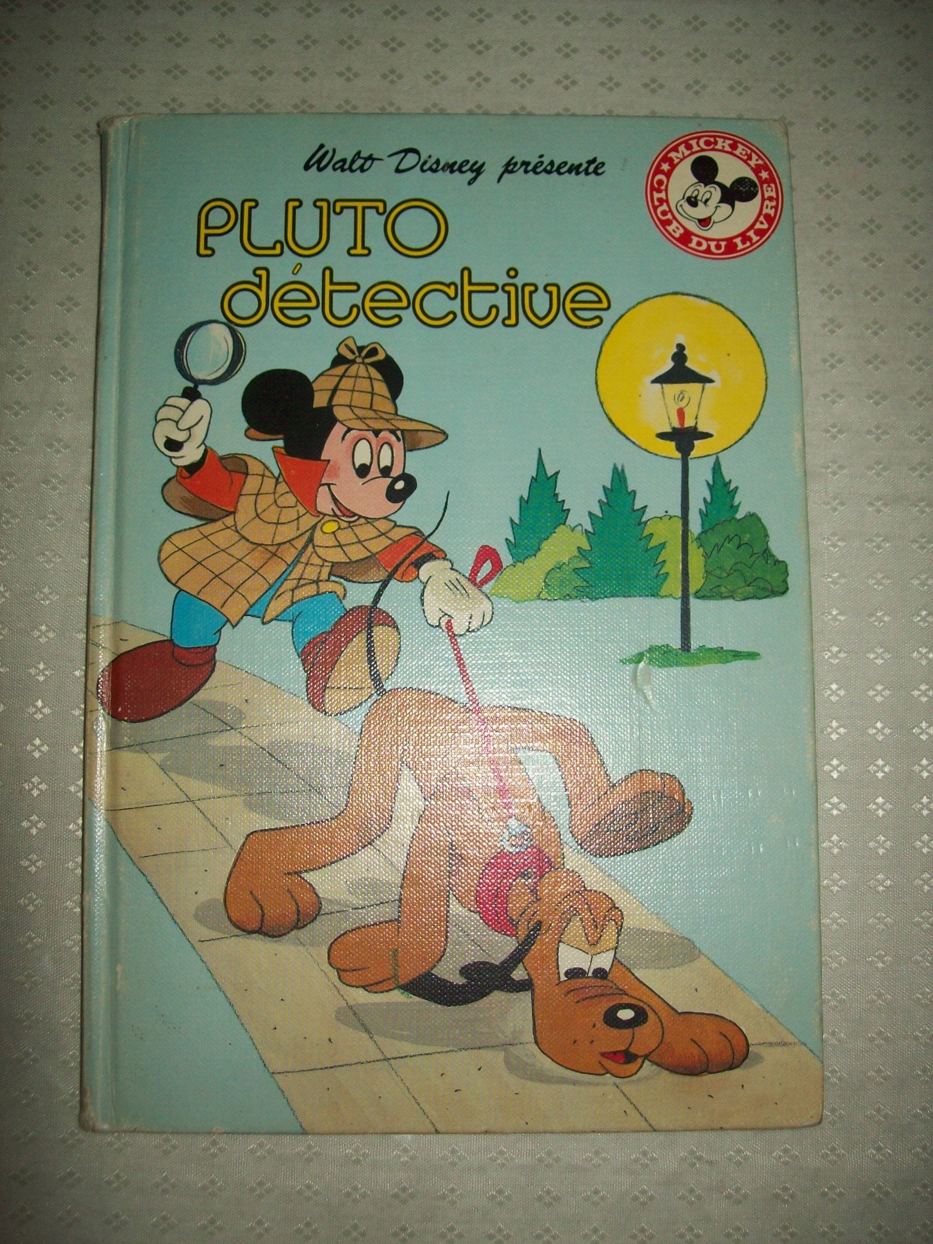 Pluto détective (Mickey club du livre) book