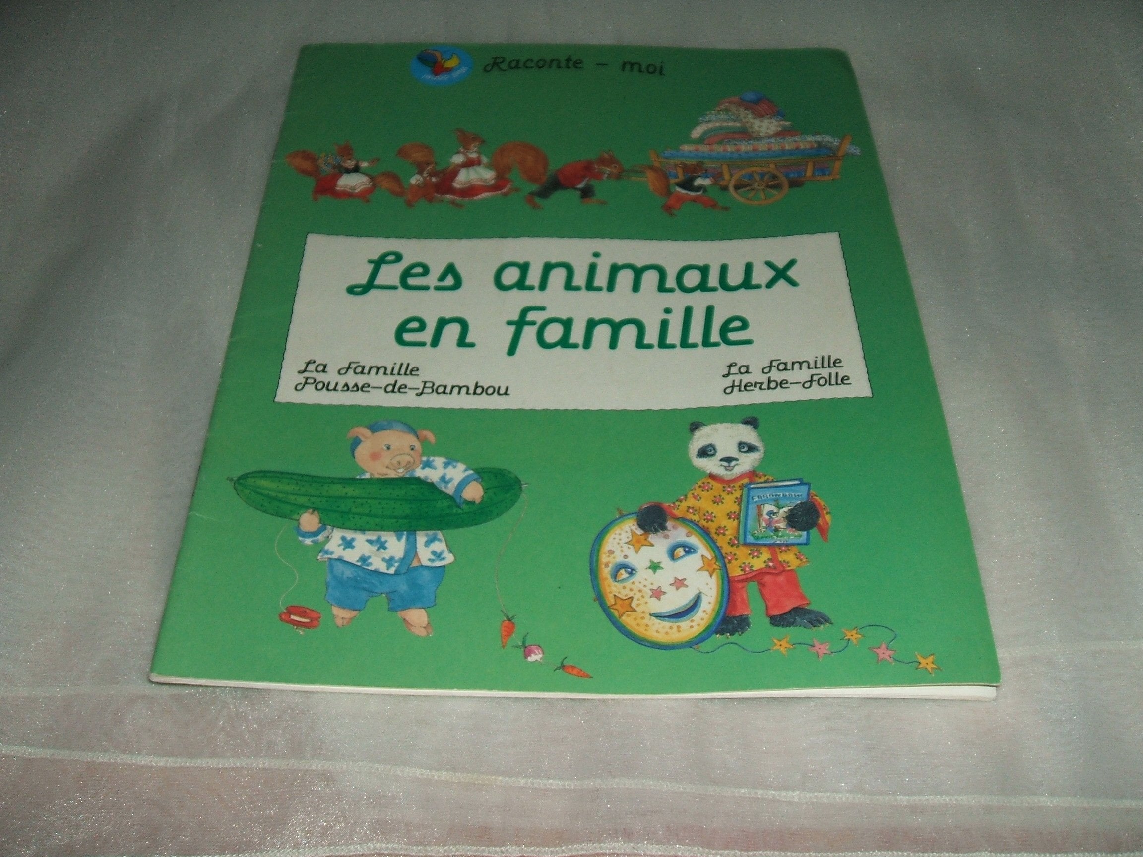 RACONTE MOI/LES ANIMAUX EN FAMILLE/LA FAMILLE POUSSE-DE-BAMBOU/LA FAMILLE HERBE-FOLLE DE 1994 book
