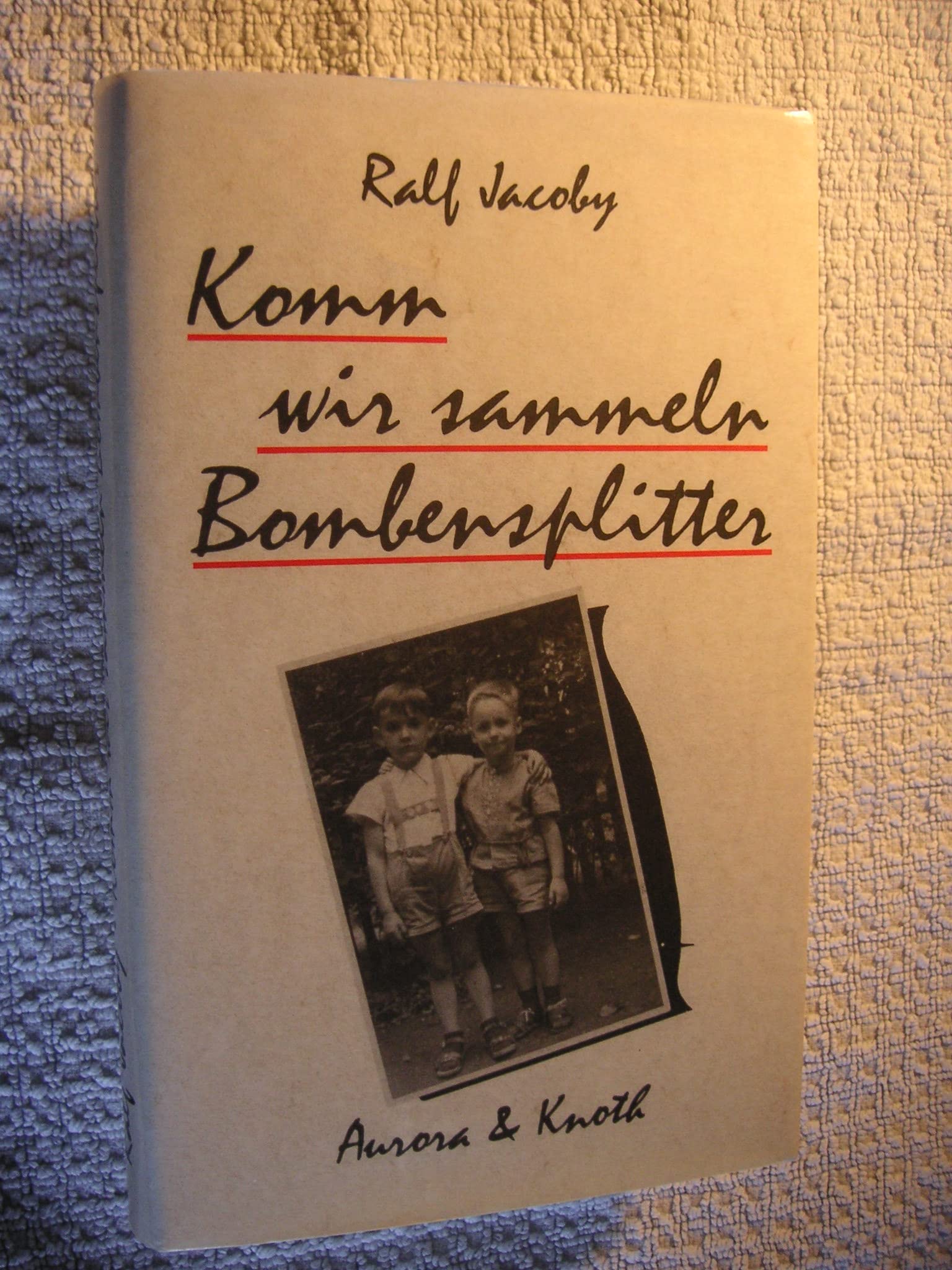 Komm wir sammeln Bombensplitter. Roman book